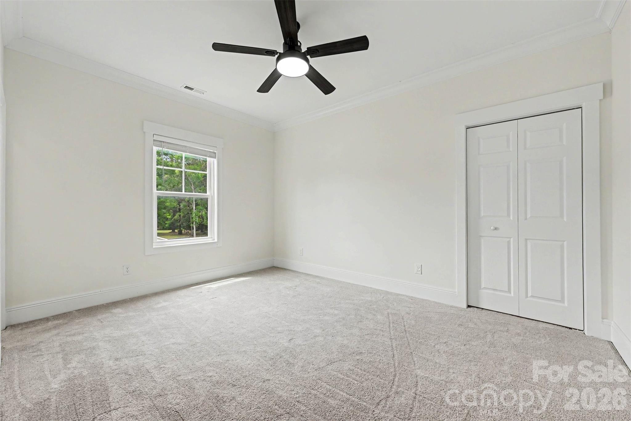 31 Ridgecrest Avenue Peachland, NC 28133 - Photo 28 of 30 an empty room with a window and a fan
