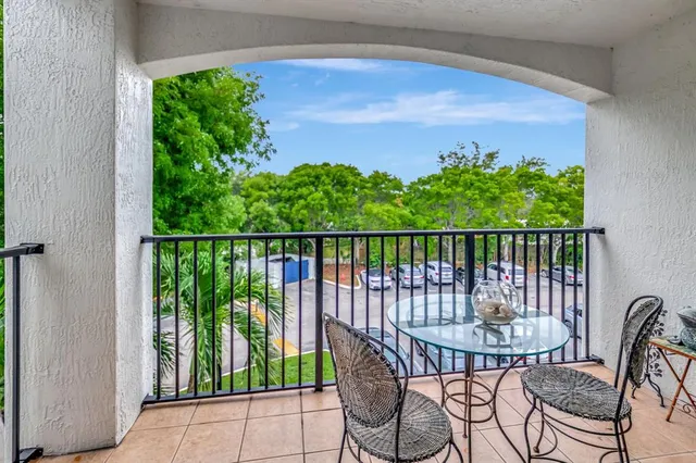 a view of a balcony with chairs