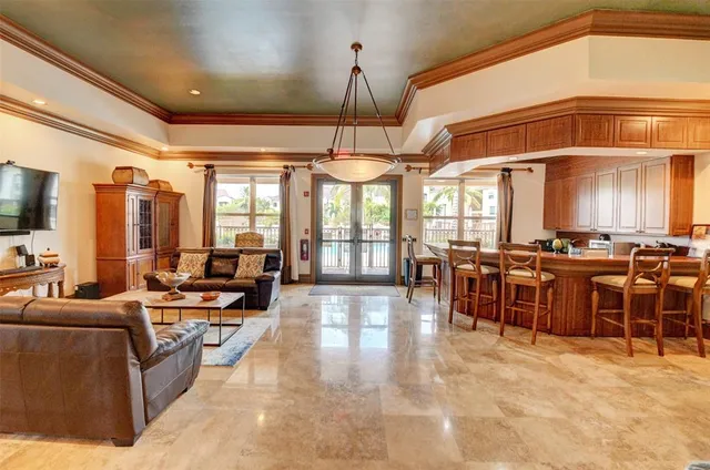 a living room with lots of tables and chairs
