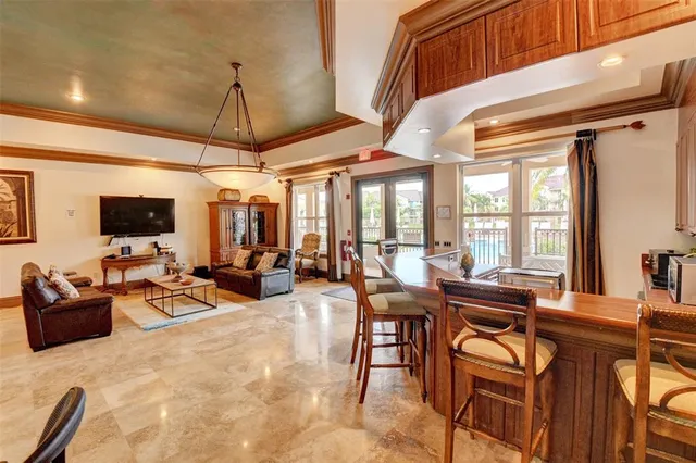 a view of a livingroom with furniture and flat screen tv