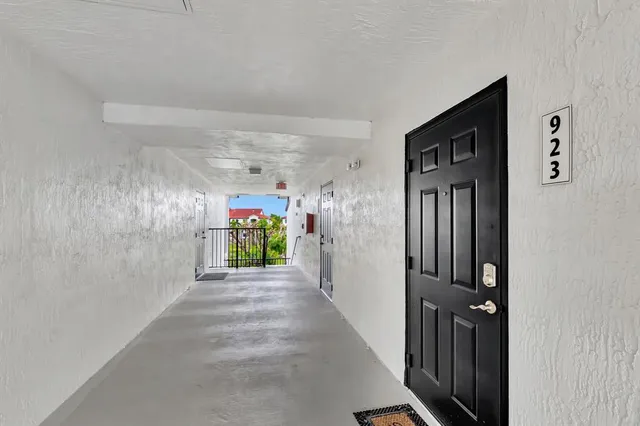 a view of a hallway view with staircase