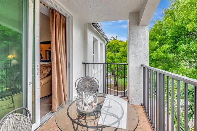 a view of a balcony from dining room