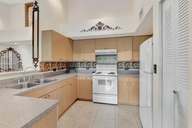 a kitchen with a stove oven and sink