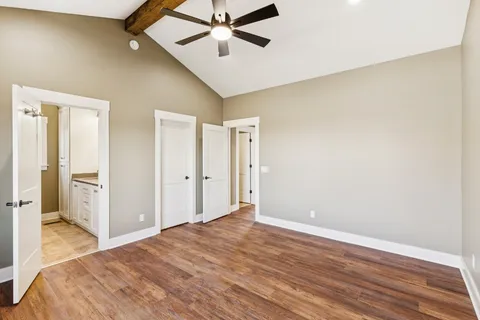 a spacious bathroom with a granite countertop sink and a mirror