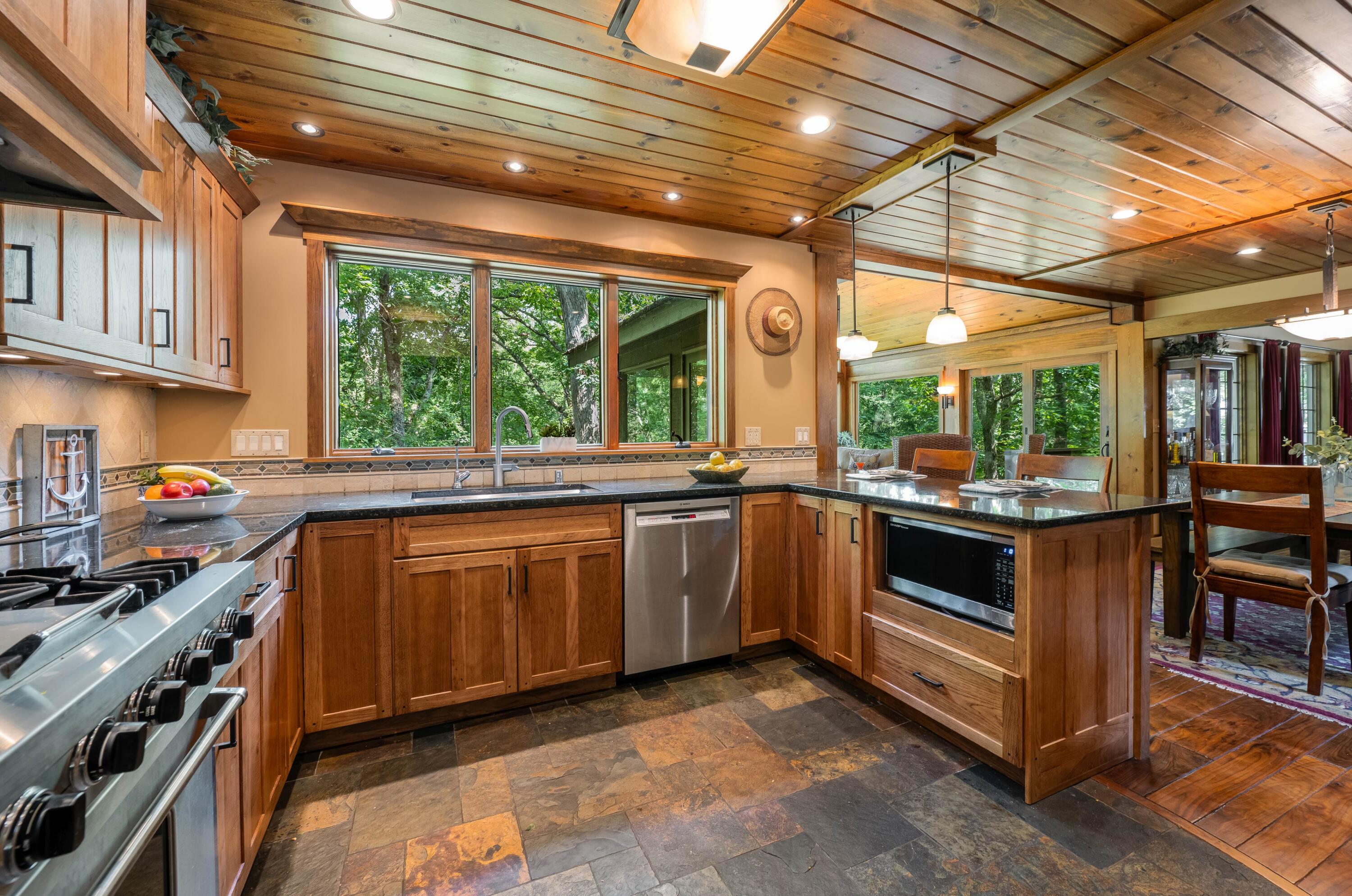 W3895 Timber Lake Road Troy, WI 53120 - Photo 14 of 64 Kitchen is open to dining room and glass viewing room.