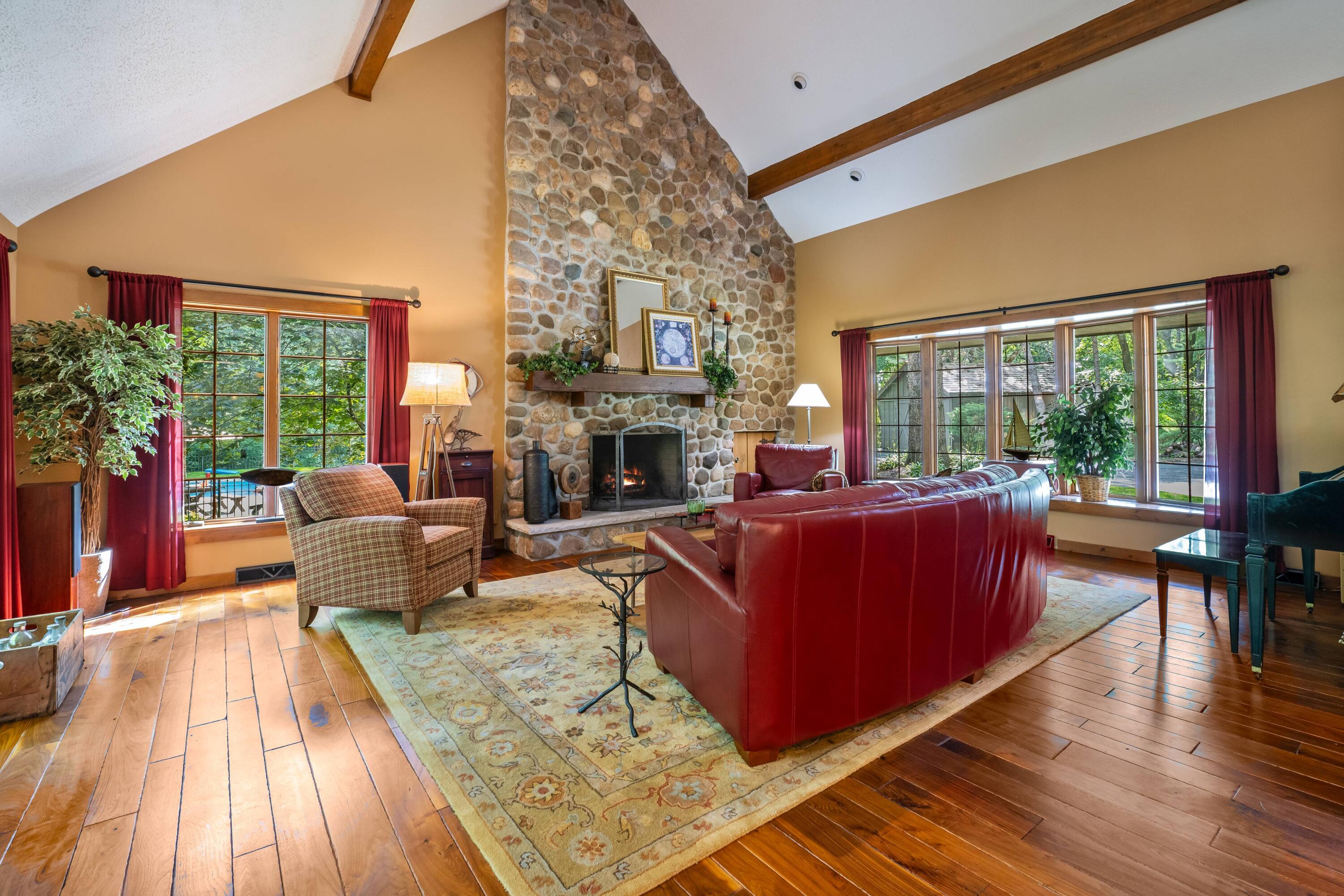 W3895 Timber Lake Road Troy, WI 53120 - Photo 18 of 64 Soaring stone mason, wood-burning fireplace.