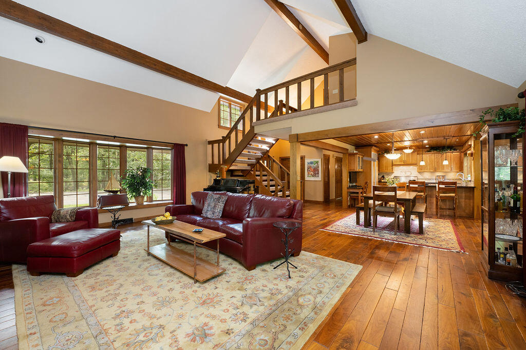 W3895 Timber Lake Road Troy, WI 53120 - Photo 21 of 64 Vaulted ceilings in Living Room with open staircase to 2nd floor
