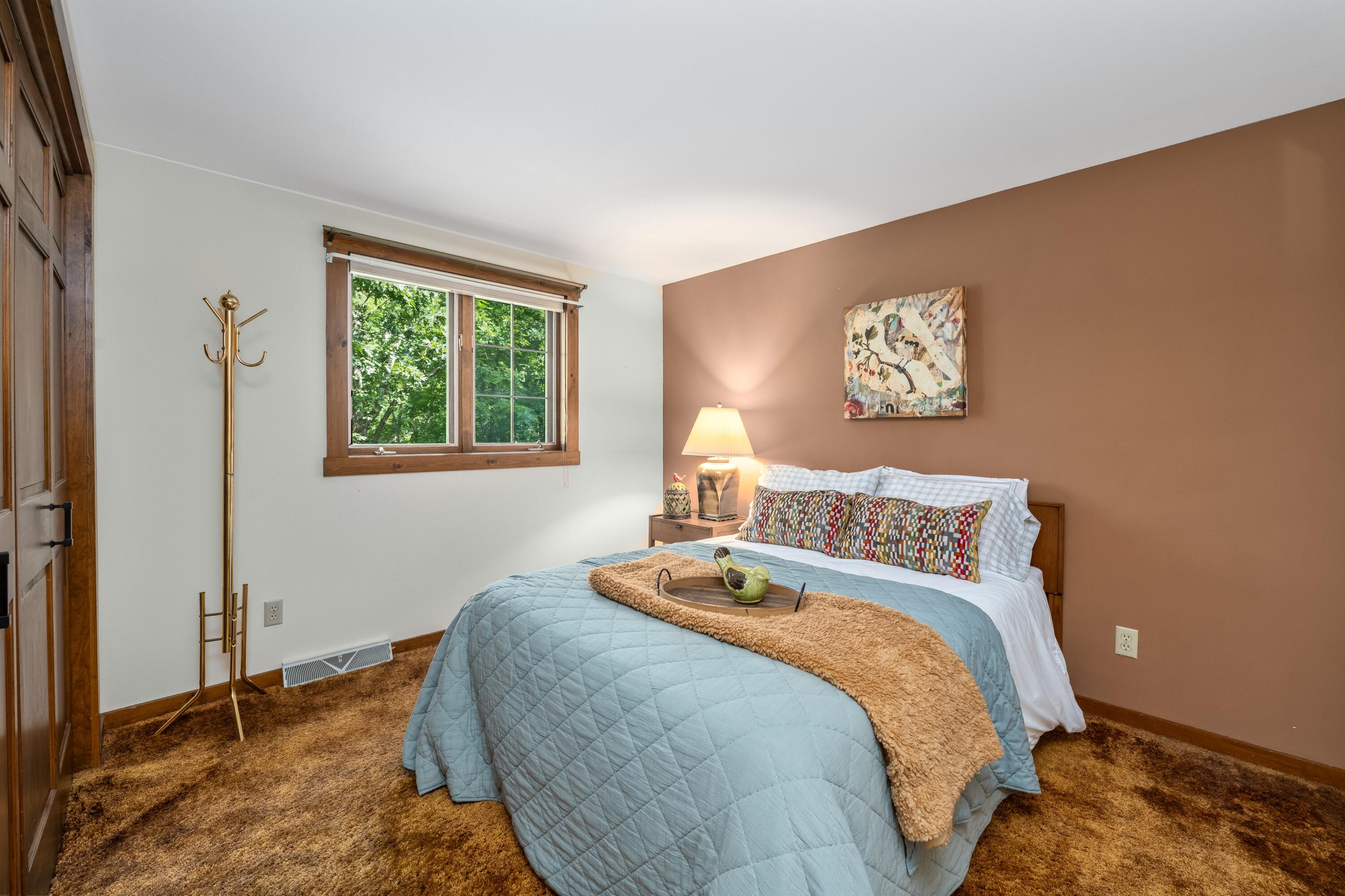 W3895 Timber Lake Road Troy, WI 53120 - Photo 22 of 64 Bedroom 2 on upper floor. 12'x11.5' with closet and view of lake.