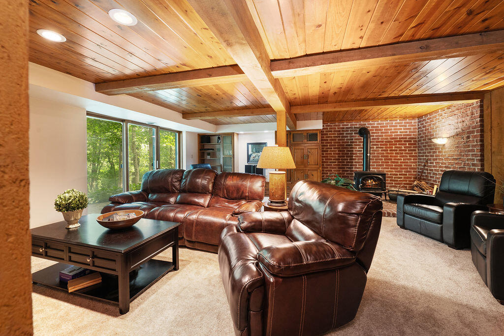 W3895 Timber Lake Road Troy, WI 53120 - Photo 25 of 64 Large family room in lower level walkout with built-ins and view of lake!