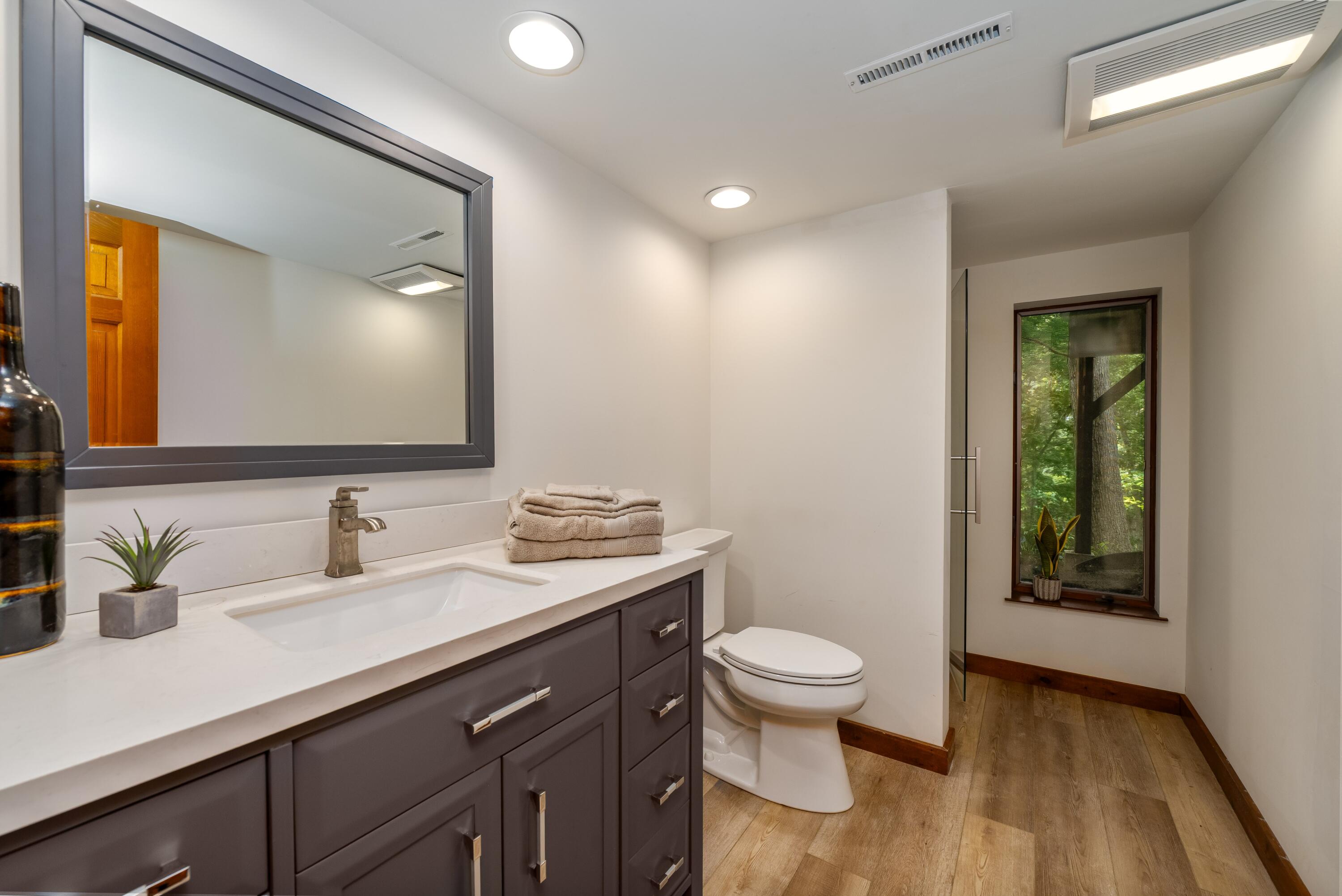 W3895 Timber Lake Road Troy, WI 53120 - Photo 28 of 64 Full bath updated in 2020 with shower stall and view of the lake!