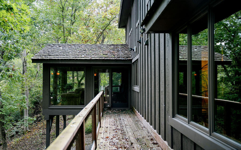 W3895 Timber Lake Road Troy, WI 53120 - Photo 31 of 64 View of glass room from exterior catwalk to cottage.