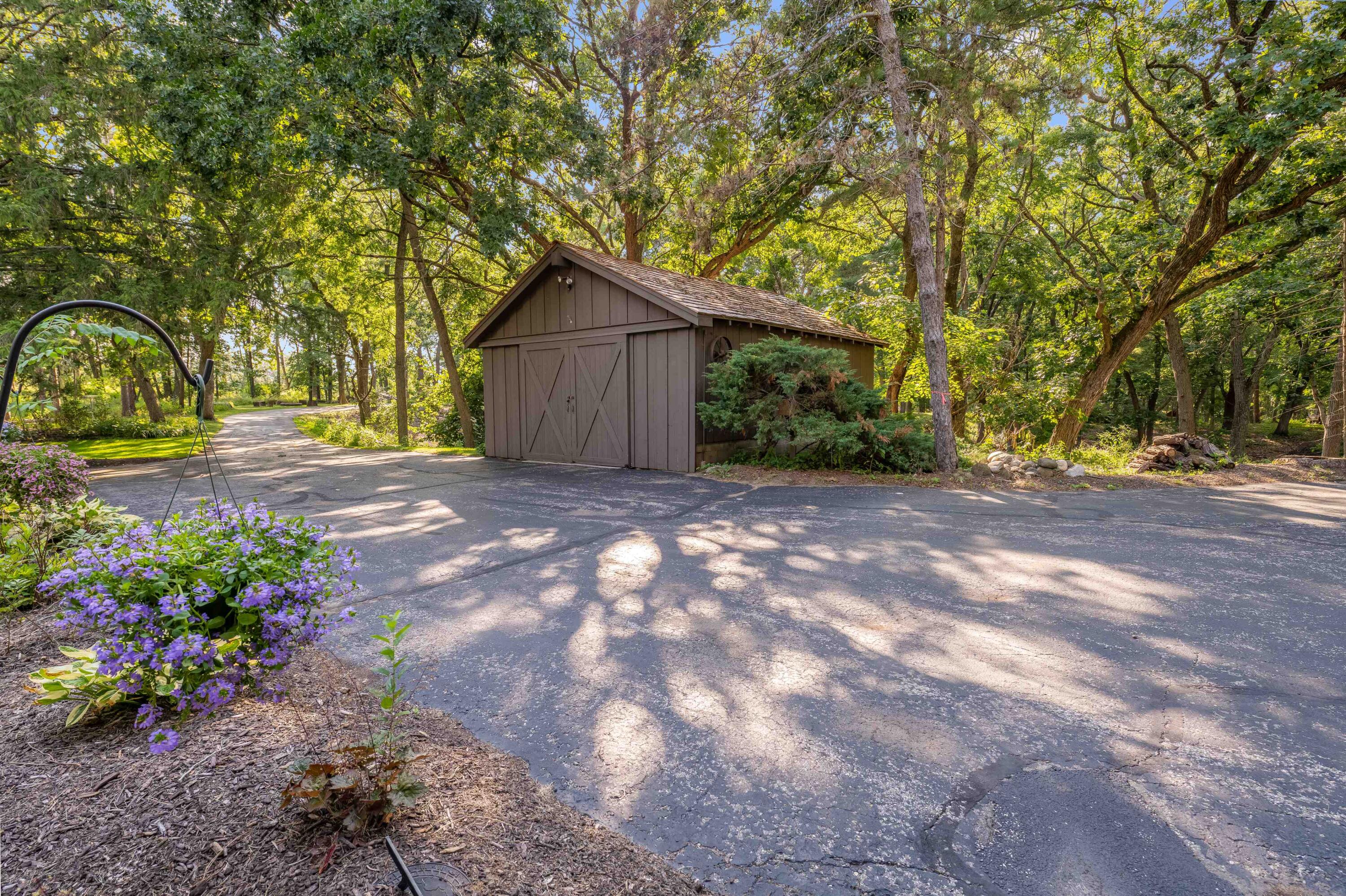 W3895 Timber Lake Road Troy, WI 53120 - Photo 36 of 64 A 20 x 24 ft barn with cement floor and electricity - original to estate