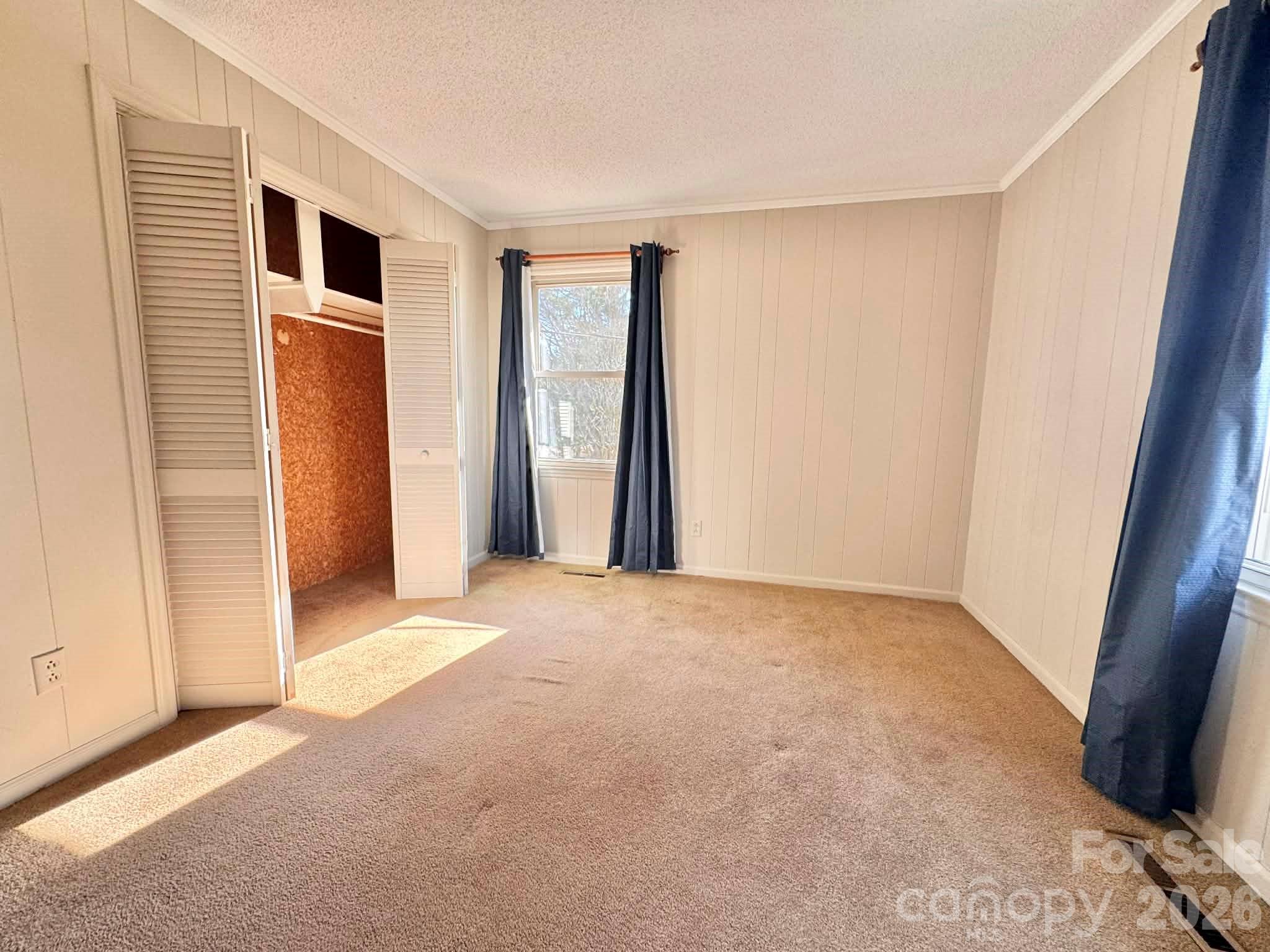 769 Dowd Road Candor, NC 27229 - Photo 17 of 32 an empty room with windows