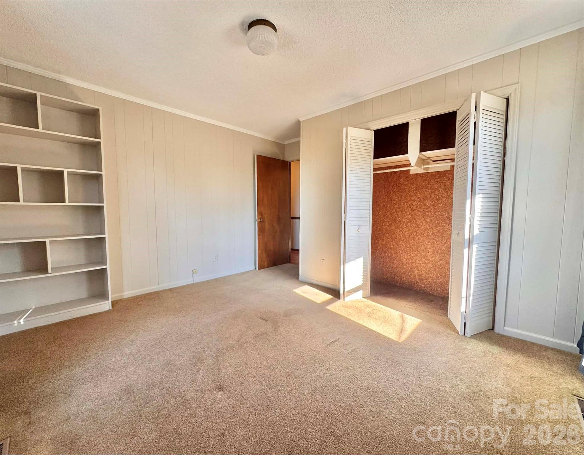 769 Dowd Road Candor, NC 27229 - Photo 19 of 32 a view of an empty room with a fireplace