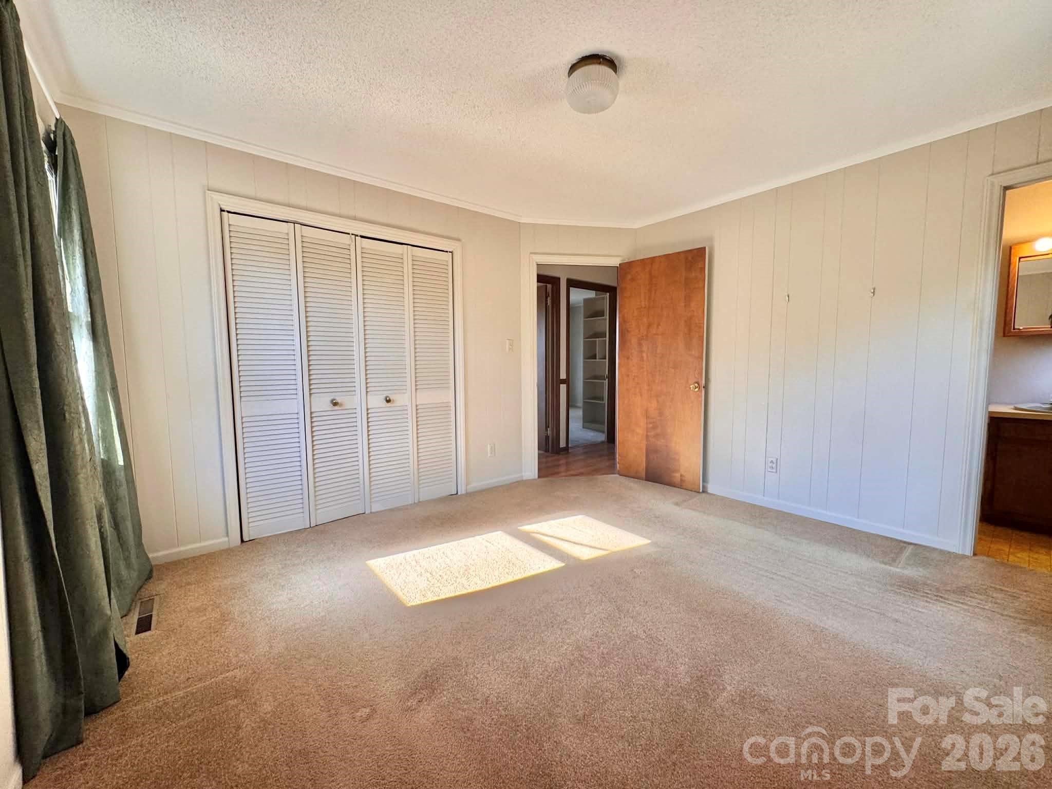 769 Dowd Road Candor, NC 27229 - Photo 21 of 32 an empty room with windows