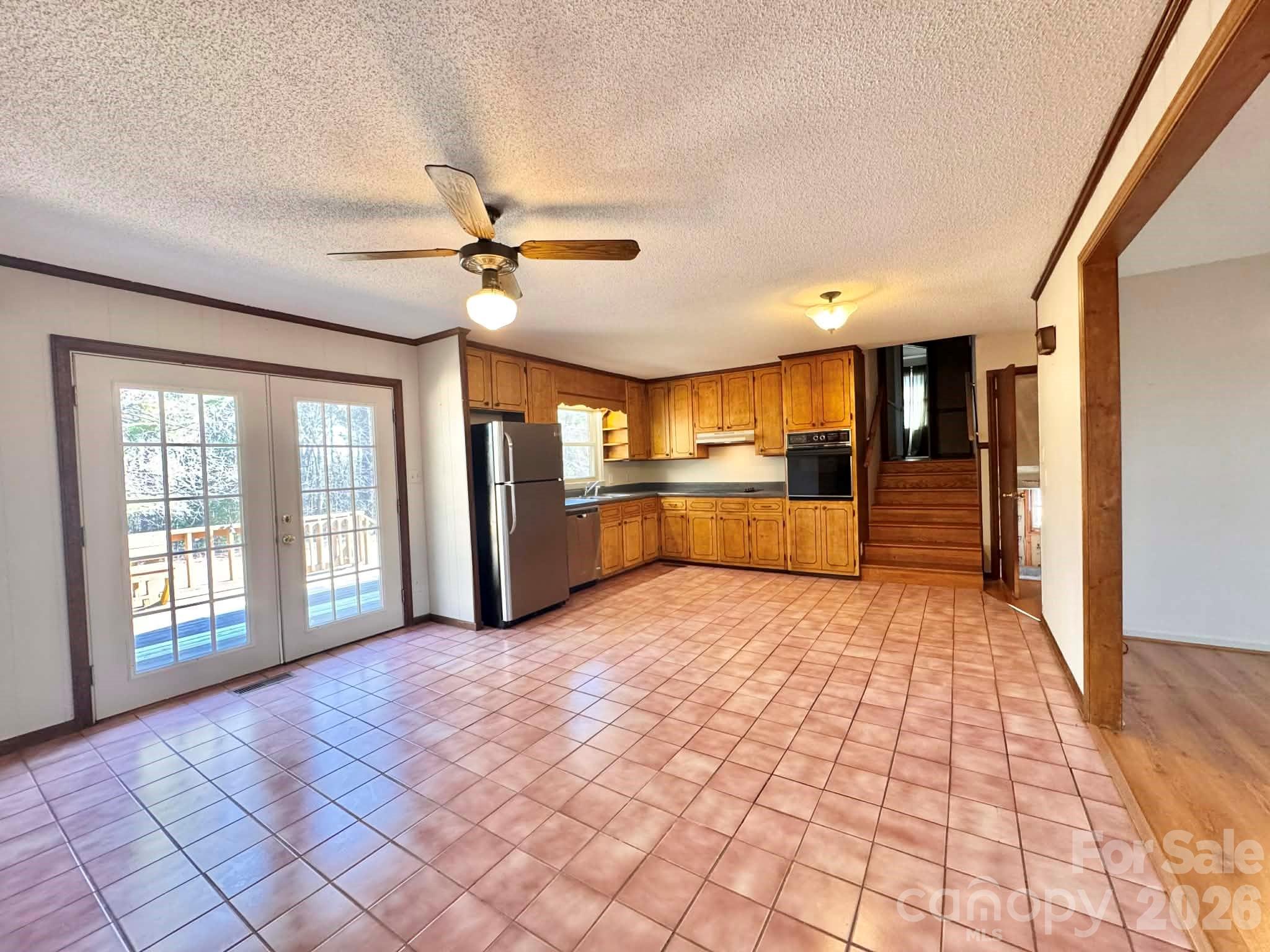 769 Dowd Road Candor, NC 27229 - Photo 5 of 32 a view of a kitchen with a sink and a stove top oven