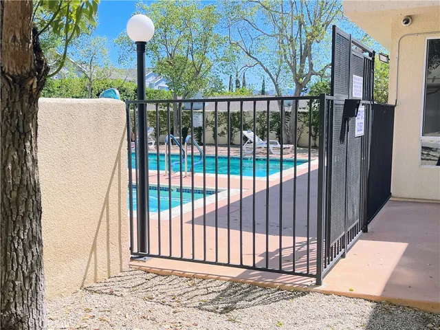 a view of a wrought iron fences in front of house