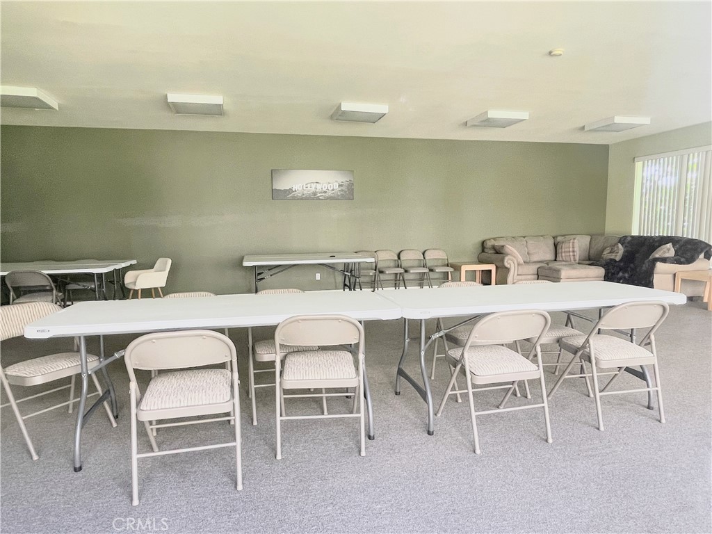19350 Sherman Way, Unit 137 Reseda, CA 91335 - Photo 14 of 21 a dining room with furniture and wooden floor