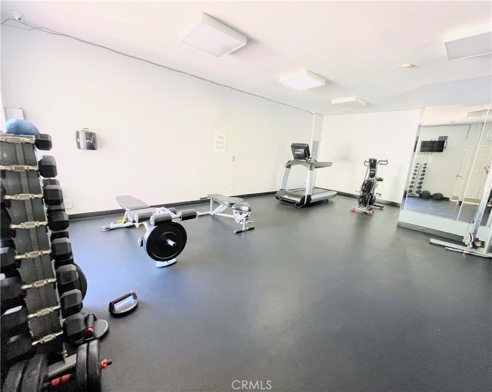 19350 Sherman Way, Unit 137 Reseda, CA 91335 - Photo 17 of 21 a view of a room with gym equipment