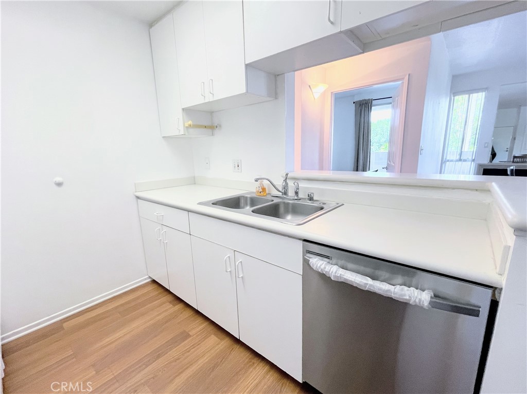 19350 Sherman Way, Unit 137 Reseda, CA 91335 - Photo 3 of 21 a room with a sink and a mirror