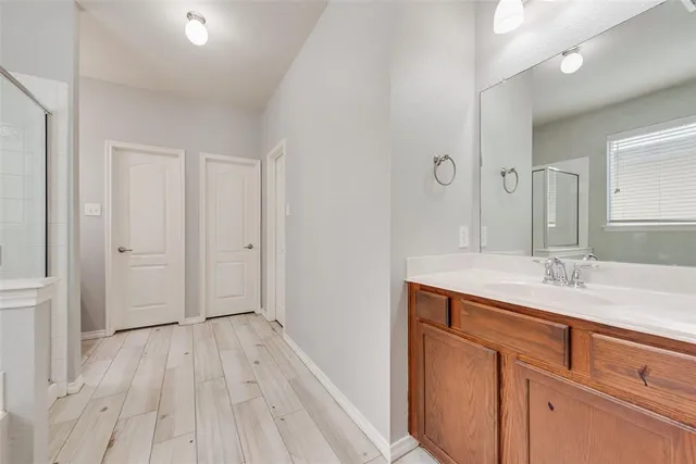 a bathroom with a sink and mirror