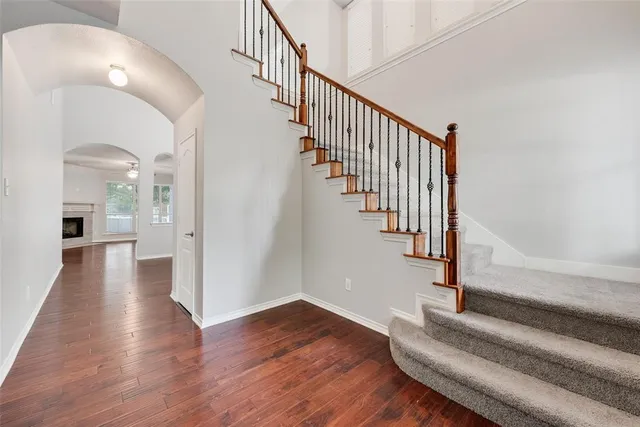 a view of entryway and hall with wooden floor