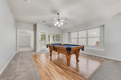 a living room with furniture a window and a table