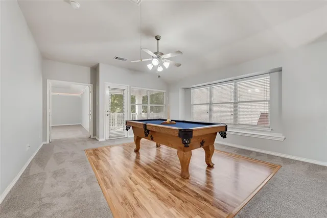 a living room with furniture a window and a table