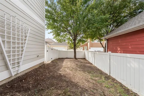 a view of a backyard of the house