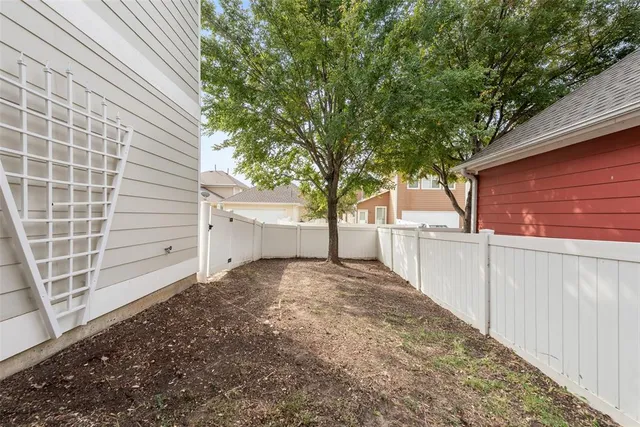 a view of a backyard of the house