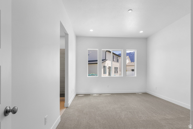 43 South Crimson Way, Unit 311 Mapleton, UT 84664 - Photo 13 of 28 Spacious room featuring three individual windows, recessed lighting, and neutral-toned carpeting
