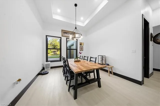 a dining room with furniture and window