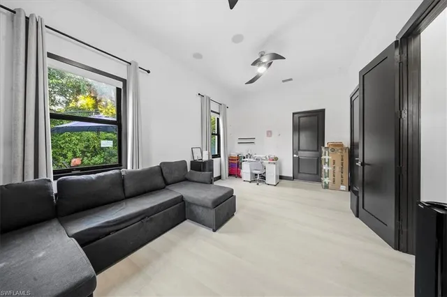 a living room with furniture and a window
