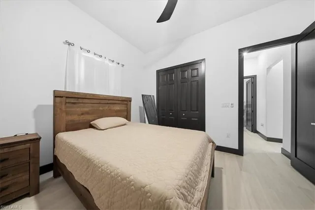 a bedroom with a bed and a dresser