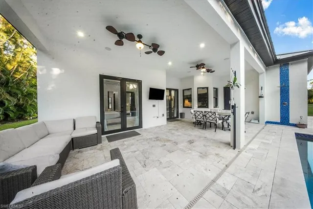 a bedroom with a bed and a large mirror