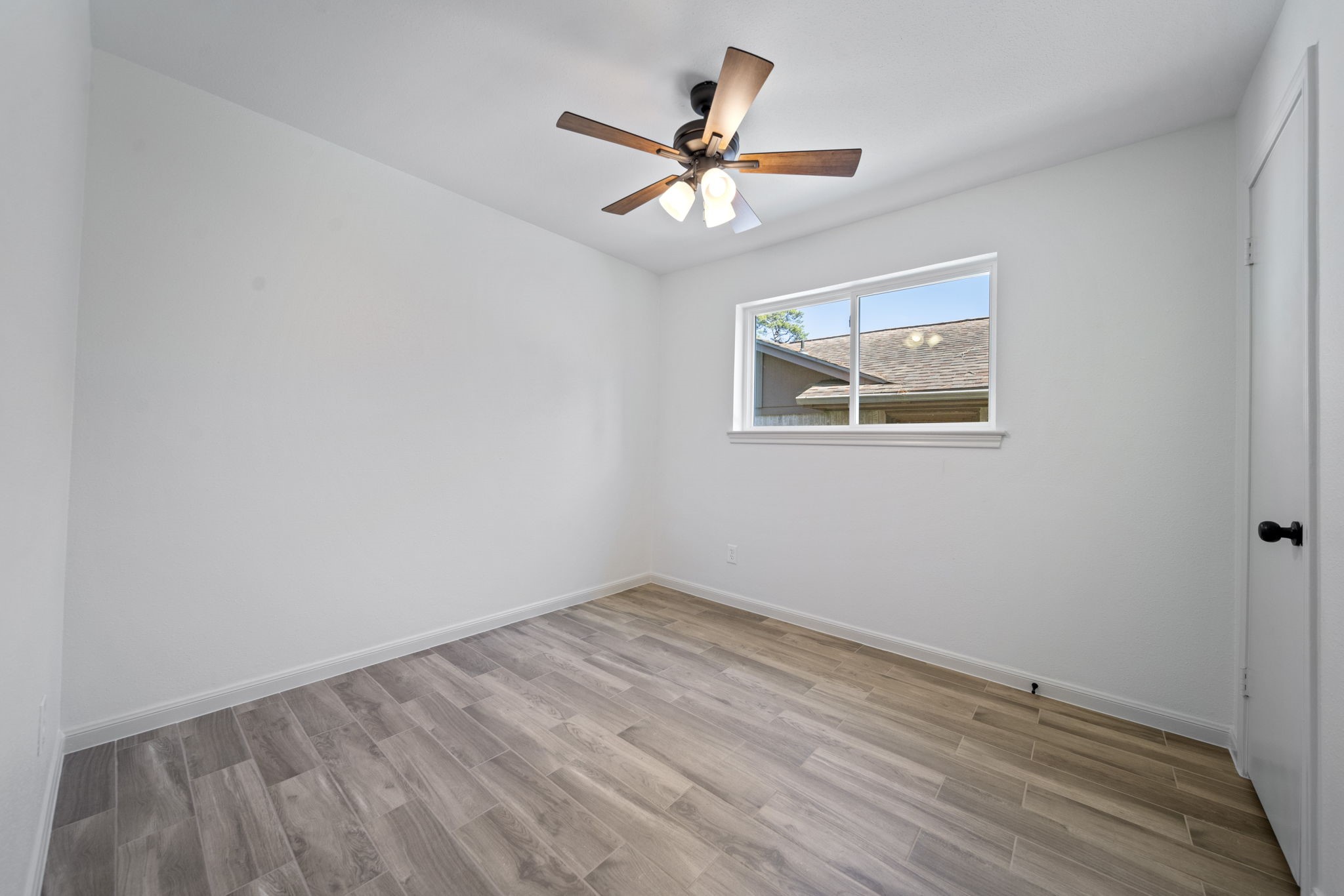 3322 Gary Lane Spring, TX 77380 - Photo 14 of 21 an empty room with a window and a ceiling fan