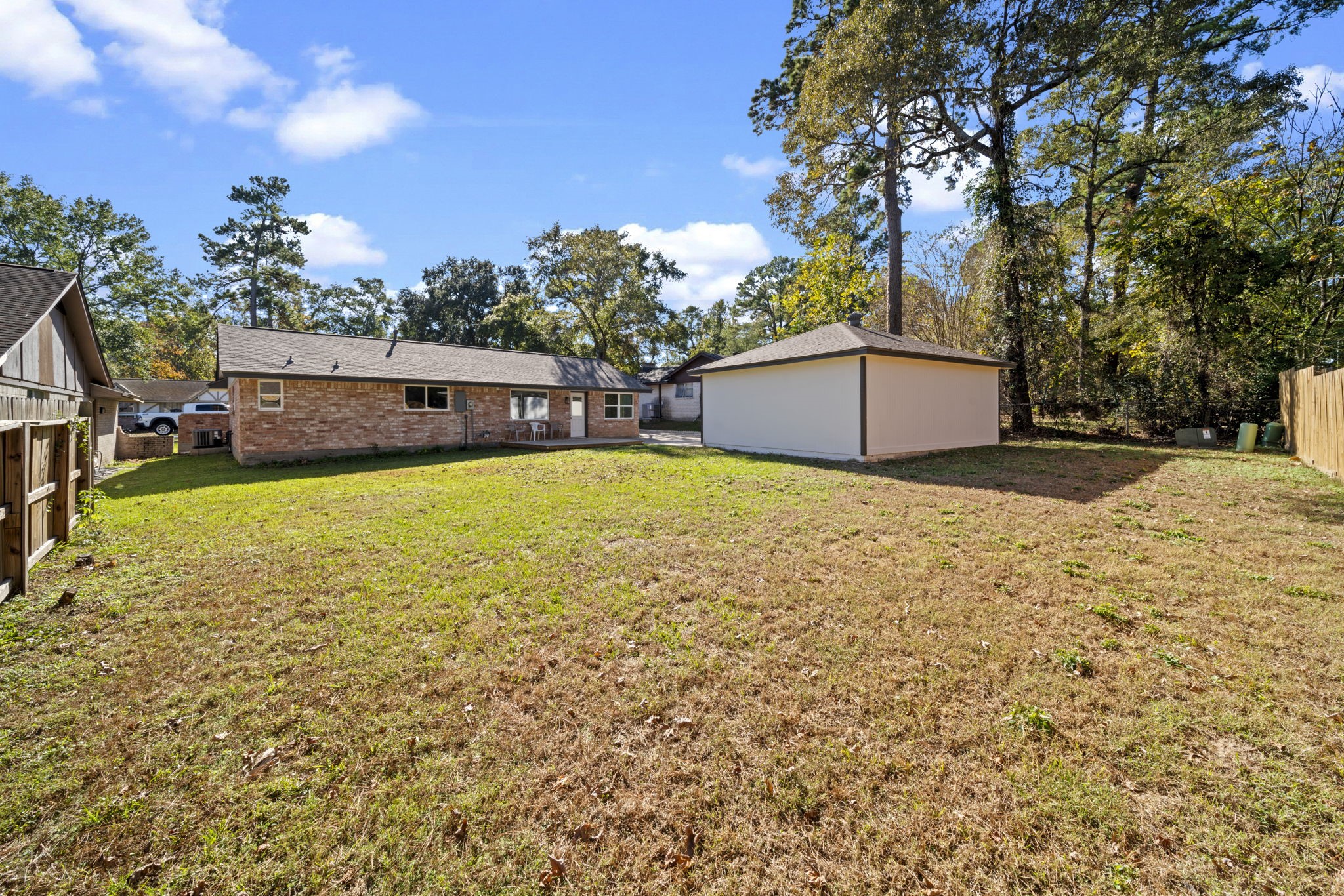 3322 Gary Lane Spring, TX 77380 - Photo 19 of 21 a view of a house with a yard and trees