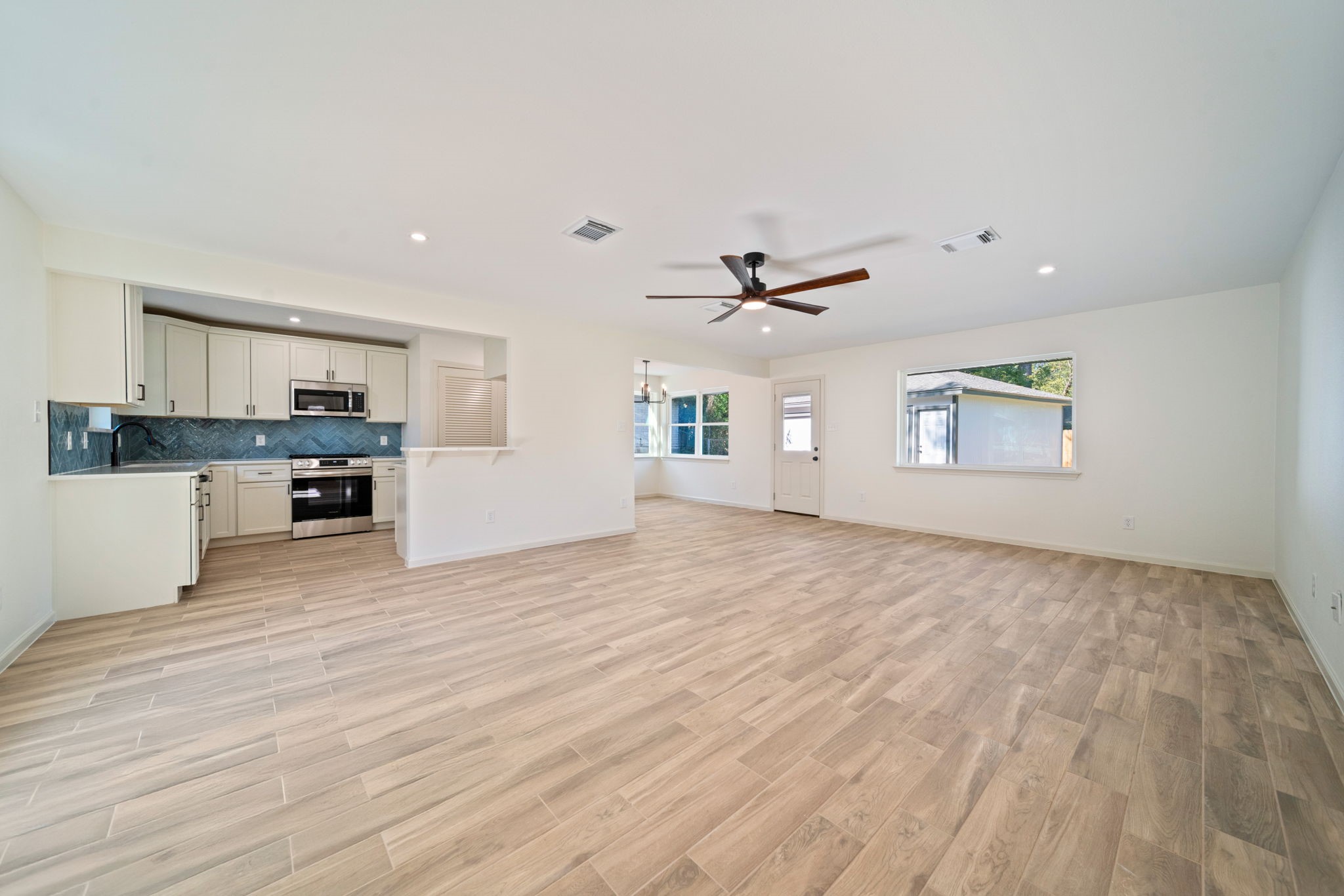 3322 Gary Lane Spring, TX 77380 - Photo 4 of 21 a view of a kitchen with wooden floor and a window