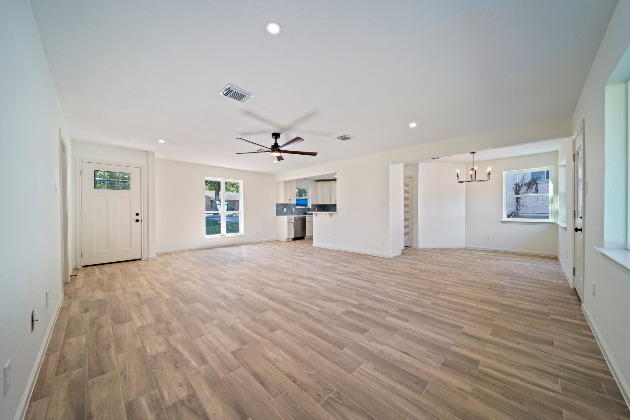 3322 Gary Lane Spring, TX 77380 - Photo 5 of 21 a view of a livingroom with wooden floor and a ceiling fan