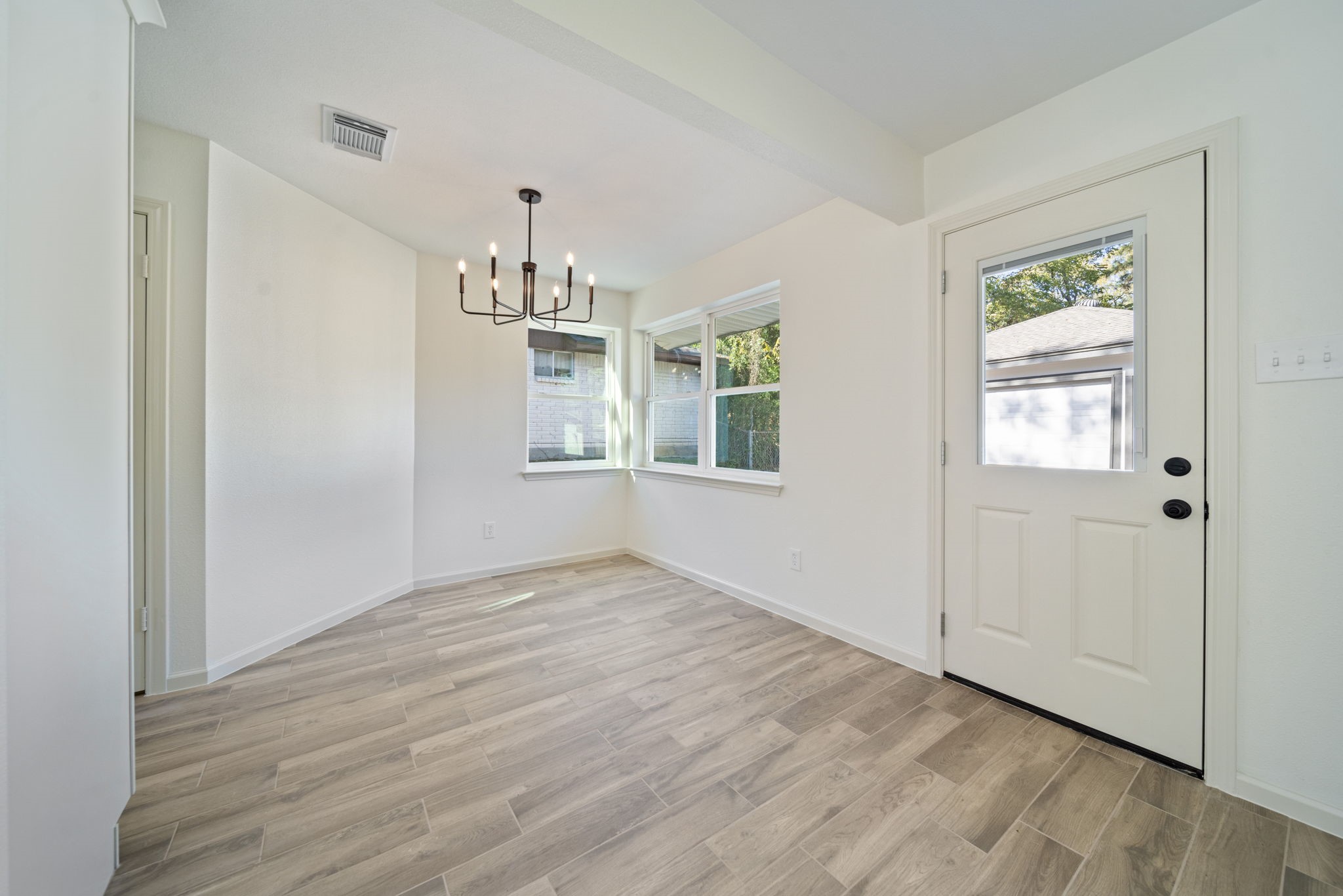 3322 Gary Lane Spring, TX 77380 - Photo 9 of 21 a view of empty room with wooden floor and fan