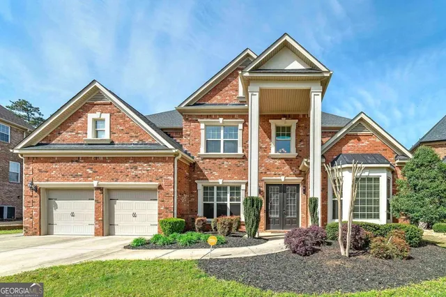 front view of a house with a yard