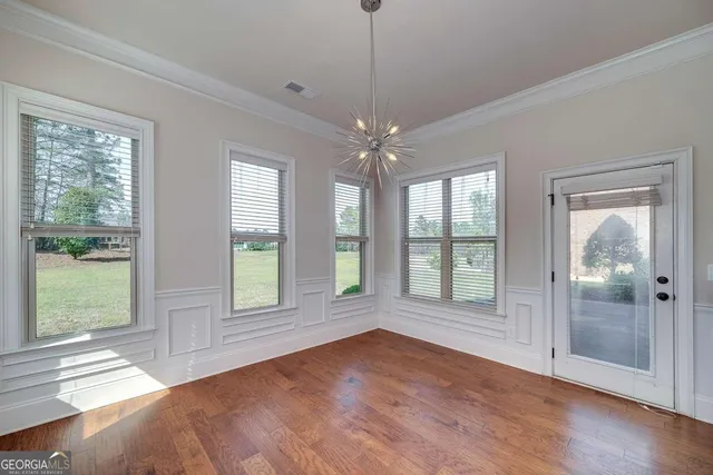 a view of kitchen with cabinets and wooden floor