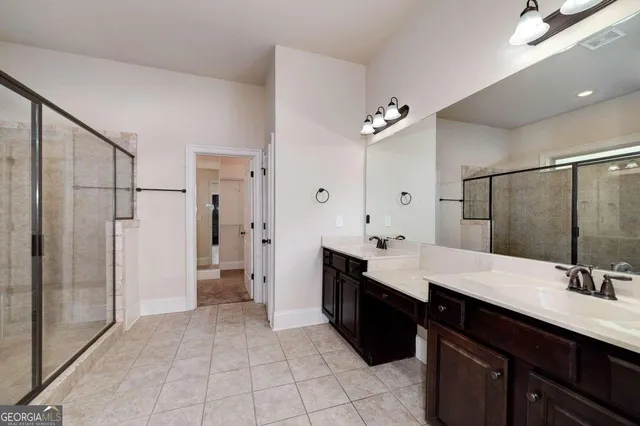 a bathroom with a glass shower door