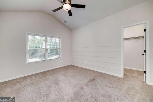 a view of a room that has a window in it