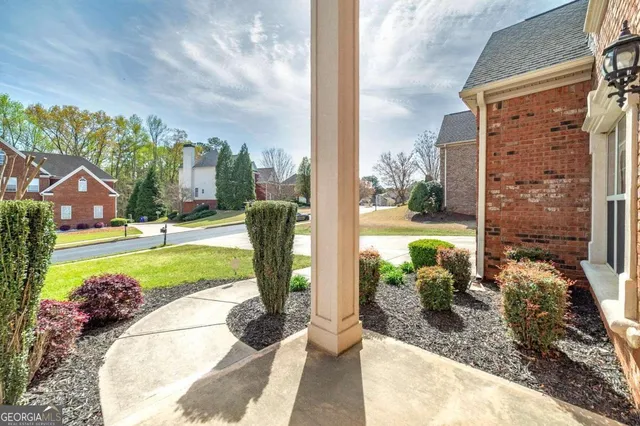 a view of staircase with wooden floor and white walls