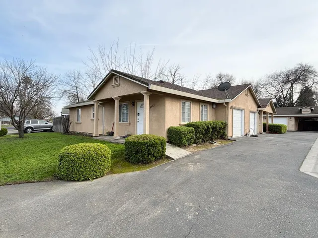 a house view with a garden space