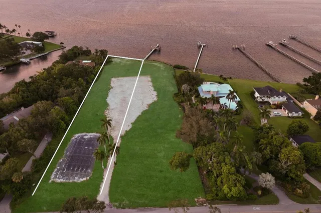 an aerial view of a house with a garden and plants