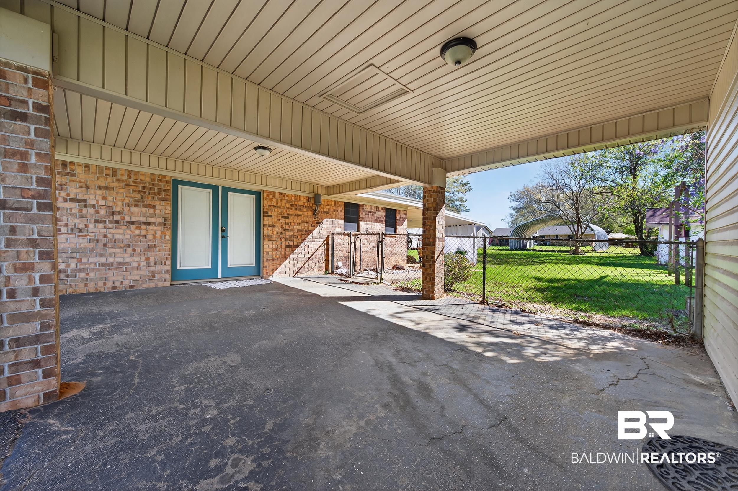 46006 Pecan Lane Bay Minette, AL 36507 - Photo 7 of 40 View of patio / terrace with an attached carport and a gate