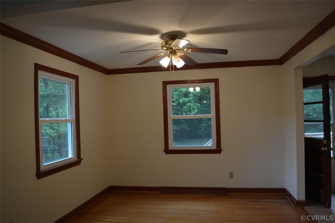 1520 Point Of Rocks Road Chester, VA 23836 - Photo 3 of 13 a view of an empty room with wooden floor and a window