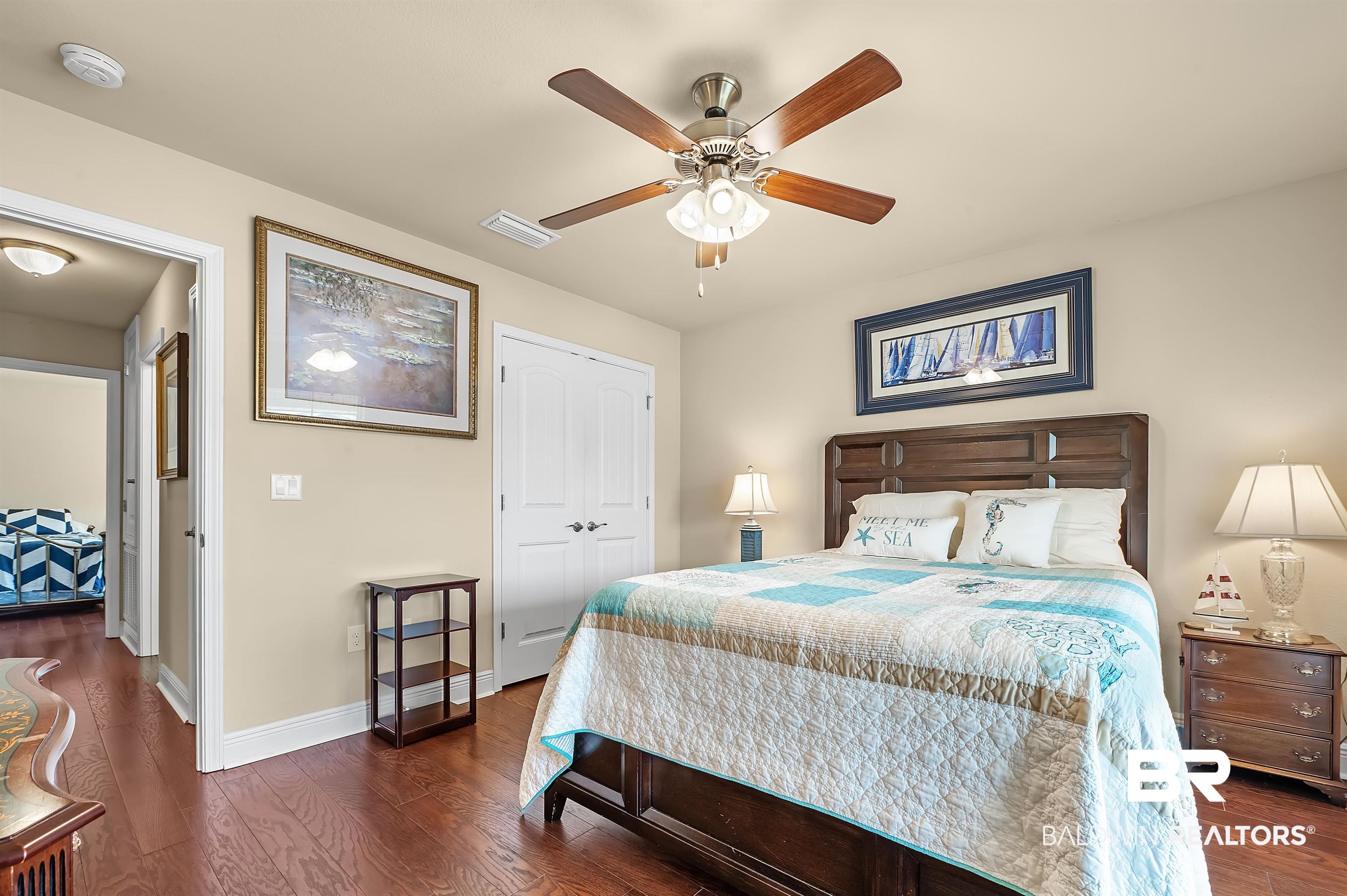 8896 Allay Lane Foley, AL 36535 - Photo 51 of 57 Bedroom with a closet, dark hardwood / wood-style floors, and ceiling fan